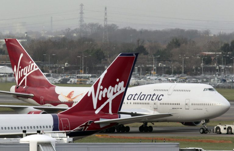 FILE - This Jan. 10, 2011 file photo shows Virgin Atlantic airplanes at London's Heathrow Airport. A big drop in customer complaints helped U.S. airlines post their best ratings ever even though more flights were late and more bags were mishandled, according to a report released Monday, April 7, 2014 by university researchers. (AP Photo/Lefteris Pitarakis, file)