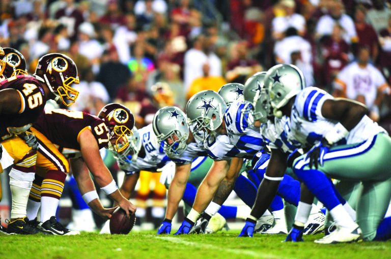 LANDOVER - SEPTEMBER 12:  Nick Sundberg #57 of the Washington Redskins prepares to snap the ball during the NFL season opener against the Dallas Cowboys at FedExField on September 12, 2010 in Landover, Maryland. The Redskins defeated the Cowboys 13-7. (Photo by Larry French/Getty Images) *** Local Caption *** Nick Sundberg