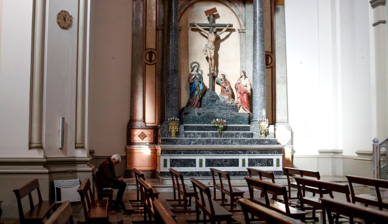A man prays inside a church on Saturday, Aug. 3, 2019. 