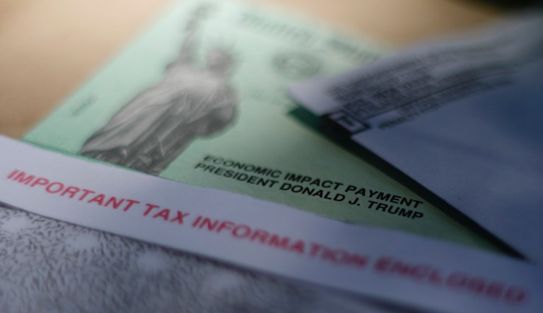 FILE - This April 23, 2020, file photo shows President Donald J. Trump's name printed on a stimulus check issued by the IRS to help combat the adverse economic effects of the new coronavirus outbreak in San Antonio. The Mexican American Legal Defense and Educational Fund is suing the federal government over its denial of federal coronavirus relief payments to U.S. citizens who are married to immigrants without social security numbers.