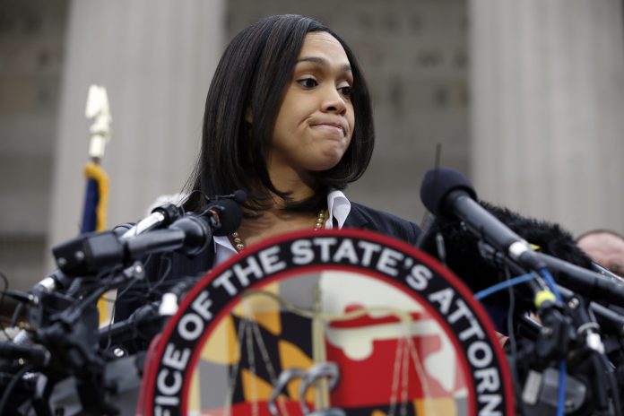 Baltimore City State's Attorney Marilyn Mosby appeared frustrated and defensive when reporters asked about her apparently-rocky relationship with Baltimore city police. (AP Photo)