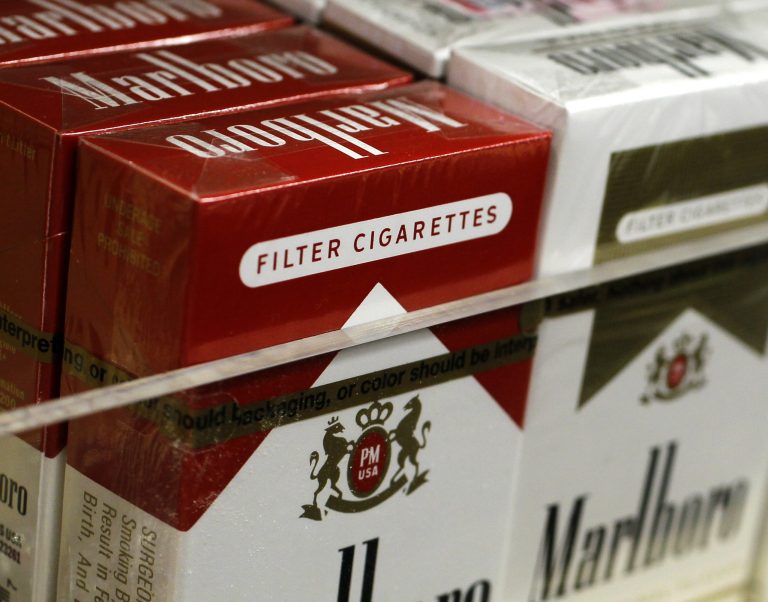   Pictured are packs of cigarettes waiting to be purchased at a Chicago area news stand Friday, Nov. 30, 2012. New tobacco products have come nearly to a halt in the U.S. because regulatory reviews for thousands of applications required by a 2009 law are taking much longer than the law requires. Though it might sound like good news from a health perspective, the halt demonstrates how tricky it is to start regulating an industry.(AP Photo/Charles Rex Arbogast)  