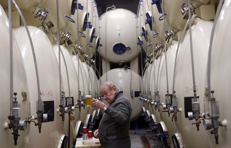   In this Tuesday, Oct. 30, 2012 photo, a brewer checks a glass of beer at the Budejovicky Budvar brewery in Ceske Budejovice, Czech Republic. They've been arguing about a name for 106 years. A small brewer in the Czech Republic and the world's biggest beer maker have been suing each other over the right to put the word Budweiser on their bottles in what has become a David versus Goliath corporate saga. A deal, it seems, will have to wait a bit longer because settlement talks between state-owned Budejovicky Budvar and Anheuser-Busch, a U.S. company now part of AB InBev, have collapsed, according to Budvar's director general, Jiri Bocek. (AP Photo/Petr David Josek)  