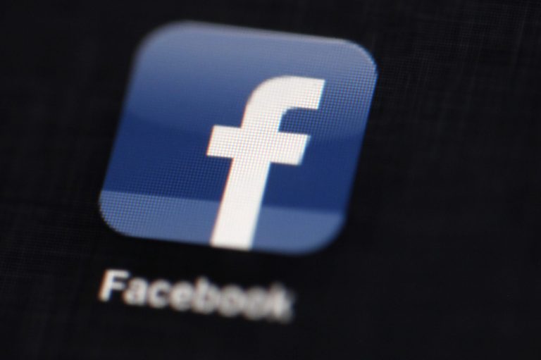 FILE - In this May 16, 2012 file photo, the Facebook logo is displayed on an iPad in Philadelphia. Under pressure from gun control advocates, Facebook agreed Wednesday, March 5, 2014,  to delete posts from users selling illegal guns or offering weapons for sale without background checks.