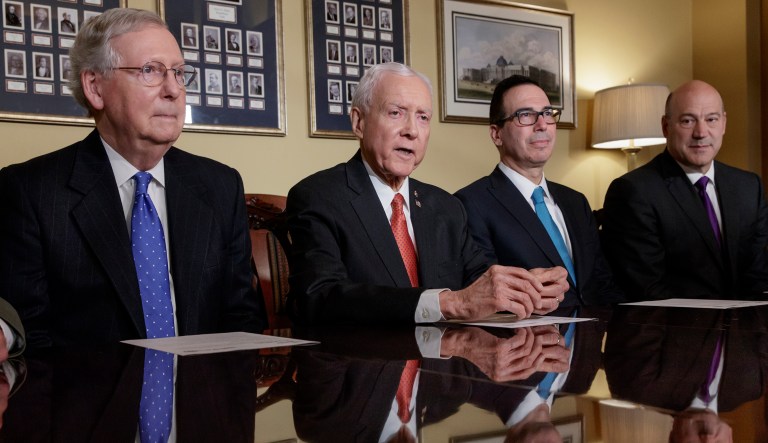 The Senate measure, which was previewed earlier Thursday but not released until the night, shares the House version's name: The Tax Cuts and Jobs Act. (AP Photo/J. Scott Applewhite)