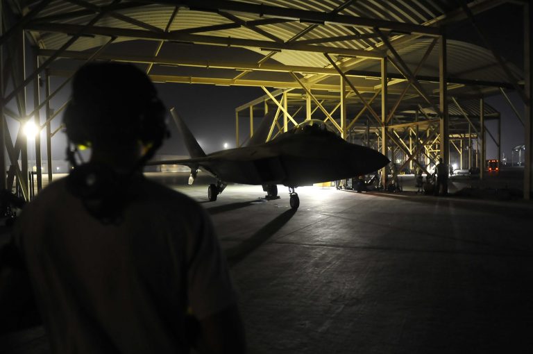 In this Tuesday, Sept. 23, 2014 photo provided by the U.S Air Force, an F-22A Raptor taxis in the U.S. Central Command area of responsibility prior to strike operations in Syria. U.S. coalition-led warplanes struck Islamic State group militants near the northern Syrian town of Kobani, also known as Ayn Arab, near the Turkish border for the first time Saturday, Sept. 27, 2014, activists and a Kurdish official said. The coalition, which began its aerial campaign against Islamic State fighters in Syria early Tuesday, aims to roll back and ultimately crush the extremist group, which has created a proto-state spanning the Syria-Iraq border. (AP Photo/U.S. Air Force, Russ Scalf)