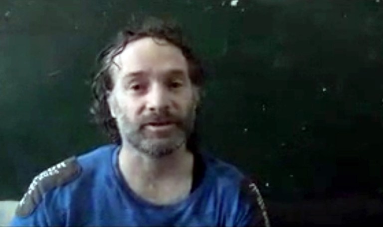 In this image made from undated video obtained by The Associated Press, which has been authenticated based on its contents and other AP reporting, a man believed to be Peter Theo Curtis, a U.S. citizen held hostage by an al-Qaida linked group in Syria, delivers a statement. The U.S. government said on Sunday, Aug. 24, 2014 that Curtis, who had been held hostage for about two years, had been released. (AP Photo)