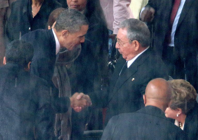 President Obama shakes hands with Cuban President Raul Castro during the official memorial service for former South African President Nelson Mandela in Johannesburg, South Africa. (Getty images)