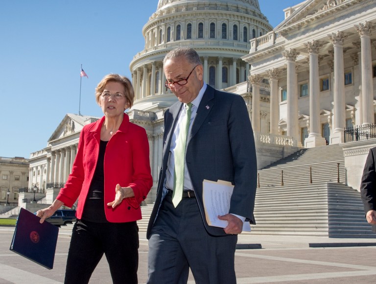 Sen. Elizabeth Warren, D-Mass., left, and Senate Minority Leader Chuck Schumer, D-N.Y., walk to a news conference on the Republican tax and budget proposals, at the Capitol in Washington, Wednesday, Oct. 18, 2017. (AP Photo/J. Scott Applewhite)