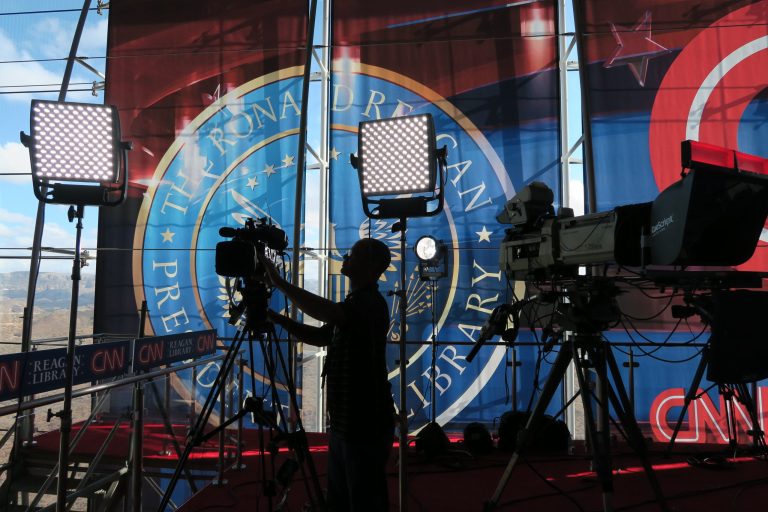 A technician adjusts a television camera before the start of the CNN Republican presidential debates at the Ronald Reagan Presidential Library and Museum Wednesday, Sept. 16, 2015 in Simi Valley, Calif. (AP Photo/Tom Stathis)
