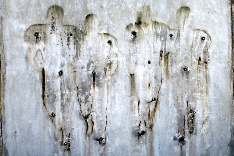   FILE - In this July 22, 2012, file photo, the outline of part of a football statue is visible on the wall after its removal in State College, Pa. The famed statue of former head coach Joe Paterno was taken down from outside the Penn State football stadium, eliminating a key piece of the iconography surrounding the once-sainted football coach accused of burying child sex abuse allegations against a retired assistant. The reverberations from the Penn State child sex abuse scandal was selected as the sports story of the year by United States editors and news directors in an annual vote conducted by The Associated Press, marking the first time that the same issue was selected in consecutive years since the AP began announcing a sports story of the year in 1990. (AP Photo/John Beale, File)  