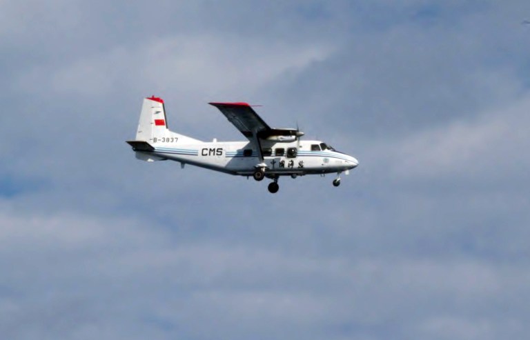   In this photo released by Japan Coast Guard 11th Regional Coast Guard, a Chinese airplane flies in Japanese airspace above the islands known as Senkaku in Japanese and Diaoyu in Chinese in southwestern Japan Thursday, Dec. 13, 2012. A Japanese government spokesman said a Chinese airplane has been spotted in Japanese airspace above the islands controlled by Tokyo but also claimed by Beijing. The Defense Agency said four Japanese F-15 jets headed to the area which has been at the center of a territorial dispute Thursday morning, but no further action was taken. (AP Photo/Japan Coast Guard 11th Regional Coast Guard) EDITORIAL USE ONLY  