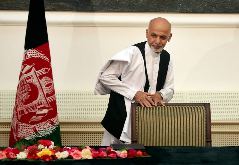 Afghanistan's presidential election candidate Ashraf Ghani Ahmadzai leaves after signing a power-sharing deal at the presidential palace in Kabul, Afghanistan, Sunday, Sept. 21, 2014. Ahmadzai, who will become president, and Abdullah Abdullah signed the national unity government deal as outgoing President Hamid Karzai watched.(AP Photo/Massoud Hossaini)