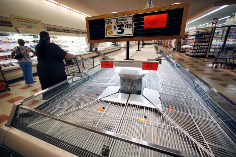 Shoppers encounter empty shelves as they shop Thursday, July 24, 2014 at the Market Basket supermarket in Haverhill, Mass. A decades-long family feud, which brought about the ouster of Arthur T. Demoulas as CEO of the privately held company, led to a worker revolt, customer boycotts and empty shelves in the grocery chain's stores in Maine, Massachusetts and New Hampshire. More than 100 Massachusetts legislators and mayors, Massachusetts Attorney General Martha Coakley, and New Hampshire Gov. Maggie Hassan have publicly supported the employees. (AP Photo)