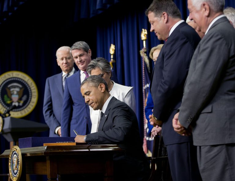 President Barack Obama signs H.R. 3080, the Water Resources Reform, Tuesday, June 10, 2014, in the South Court Auditorium in the Eisenhower Executive Office Building on the White House complex in Washington, Tuesday, June 10, 2014, in Washington. From left are, Vice President Joe Biden, Sen. David Vitter, R-La., and Sen. Barbara Boxer, D-Calif.  (AP Photo/Pablo Martinez Monsivais)