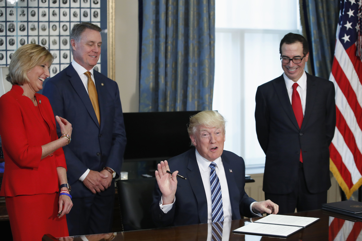 No, Trump wasn’t being serious when he joked he doesn’t read his executive orders