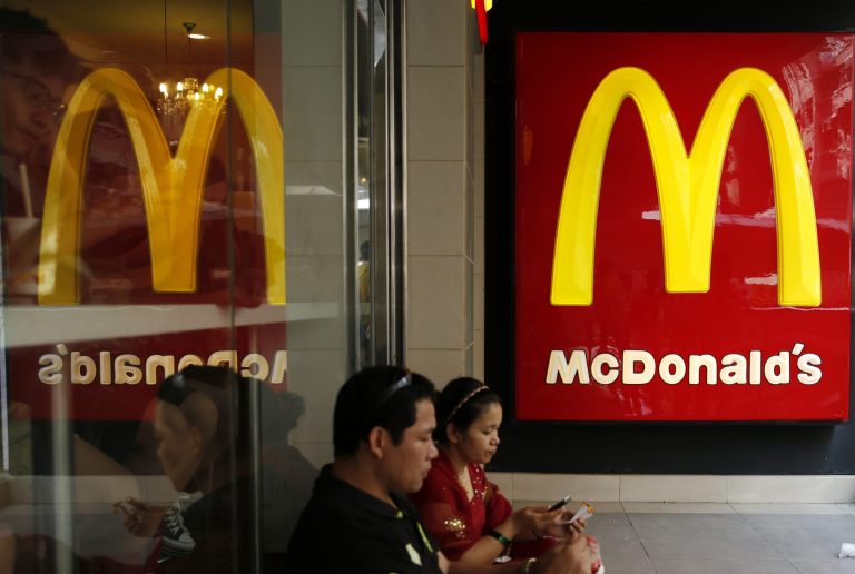 Customers sit at a McDonald's restaurant. (AP Photo/Kin Cheung)
