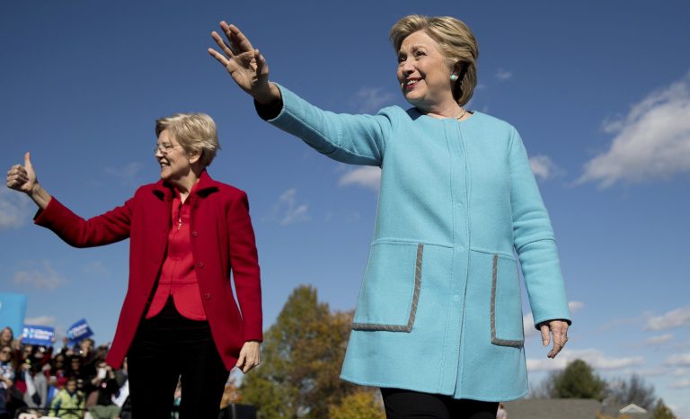 Democratic presidential candidate Hillary Clinton, right, accompanied by Sen. Elizabeth Warren, D-Mass., arrives at a rally at St. Anselm College in Manchester, N.H., Monday, Oct. 24, 2016.