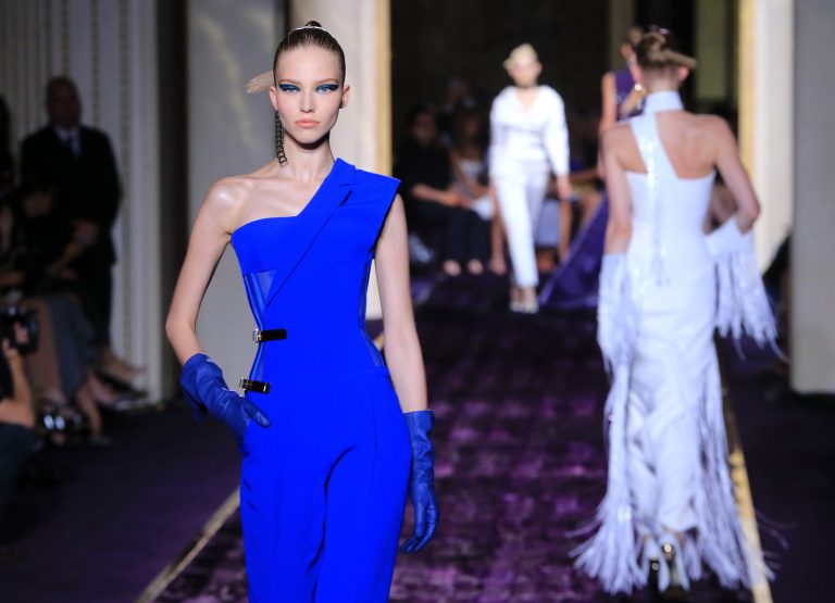 Models present creations by Italian fashion designer Donatella Versace, as part of the Atelier Versace Fall Winter 2014-15 Haute Couture fashion collection, Sunday, July 6, 2014, in Paris. (AP Photo/Jacques Brinon)