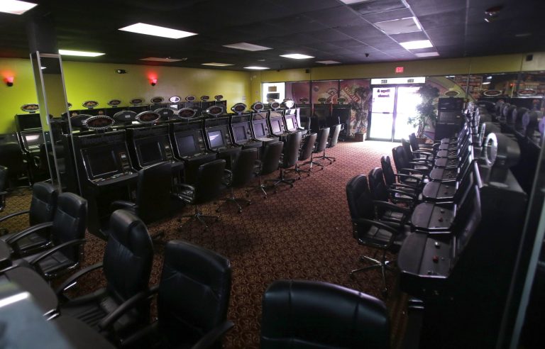 Turned off gambling machines are shown at the Tropicana Bingo and Arcade in Hialeah, Fla., Thursday, April 10, 2013. Gaming centers also known as 