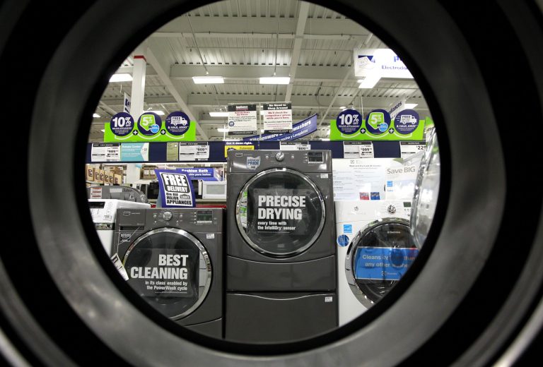 FILE - In this Monday, Sept. 10, 2012 file photo, dryers are seen from the inside of another clothes' dryer, foreground, at a Lowe's store location, in Framingham, Mass. Lowe's Cos. Inc. reports quarterly financial results before the market opens on Wednesday, Feb. 26, 2014. (AP Photo/Steven Senne, File)