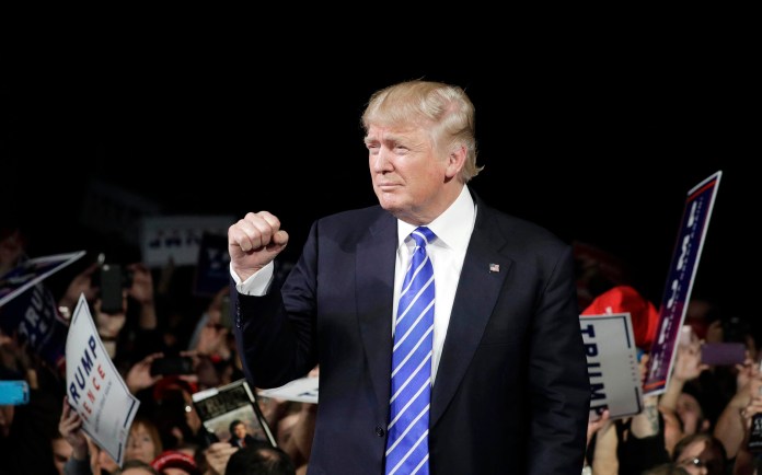 With this victory in Michigan, which will be officially certified by the state's board of Canvassers on Nov. 28, Trump has 306 electoral votes to Clinton's 232. (AP Photo/John Locher)