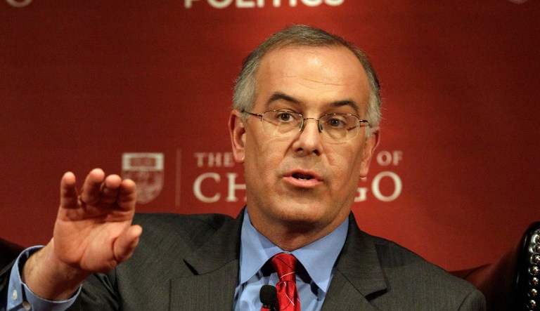In this Jan. 19, 2012, file photo, New York times columnist David Brooks shares a stage with pundits during a panel discussion, "2012: The Path to the Presidency", at the University of Chicago in Chicago. Brooks has become a target of online criticism over an opinion piece published July 11, 2017,  in which he describes taking a friend without a college degree to a Mexican restaurant because he assumed she was intimidated by the menu at a gourmet eatery.