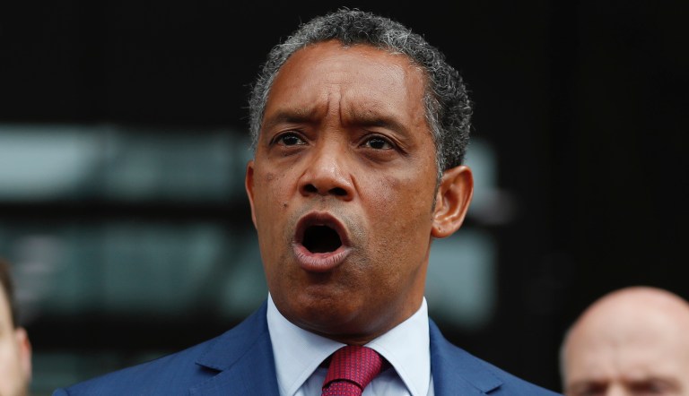 District of Columbia Attorney General Karl Racine, joined by from left, District of Columbia Council member Charles Allen and District of Columbia Council Chairman Phil Mendelson, speaks at One Judiciary Square in Washington, Thursday, Oct. 5, 2017.