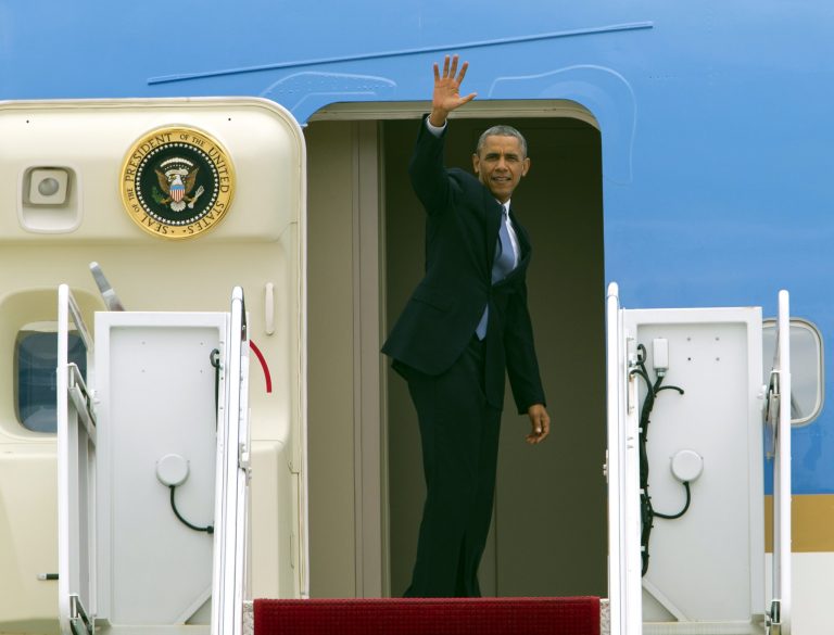 President Barack Obama waves from Air Force One before departure at Andrews Air Force Base, Md., on Tuesday, en route to Seattle in a three-day West Coast trip includes at least five fundraising events in Seattle, San Francisco and Los Angeles. (AP Photo/Jose Luis Magana)