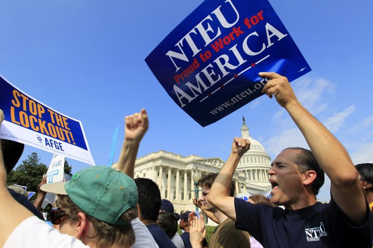 Union workers demonstrate during a rally against the government shutdown outside of the U.S. Capitol on Friday. (AP/Jose Luis Magana)