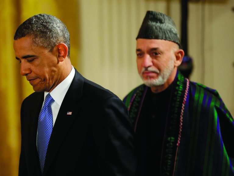 President Barack Obama and Afghan President Hamid Karzai arrive for their joint news conference in the East Room of the White House in Washington, Friday, Jan. 11, 2013. (AP Photo/Pablo Martinez Monsivais)