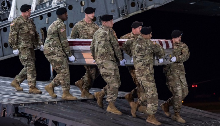 In this image provided by the U.S. Army, a carry team of soldiers from the 3d U.S. Infantry Regiment (The Old Guard), carry the transfer case during a casualty return for Staff Sgt. Dustin M. Wright, of Lyons, Ga., at Dover Air Force Base, Del., Oct. 5, 2017. U.S. and Niger forces were leaving a meeting with tribal leaders when they were ambushed on Oct. 4 and Wright and three other soldiers were killed. There were about a dozen U.S. troops and a company of Niger forces, for a total of about 40 service members in the joint mission. (Pfc. Lane Hiser/U.S. Army via AP)