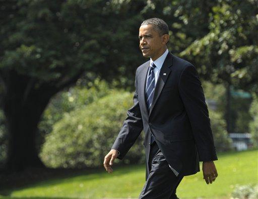 President Barack Obama heads to Marine One on the South Lawn of the White House in Washington, Tuesday, Sept. 13, 2011, as he heads to Ohio. (AP Photo/Susan Walsh)