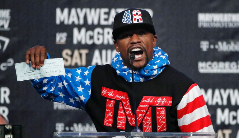 Floyd Mayweather Jr. is expected to earn over $100 million next month when he fights Irish mixed martial artist Conor McGregor, but he's fuming that he's on the hook for back taxes to the IRS. (AP Photo/Jae C. Hong)