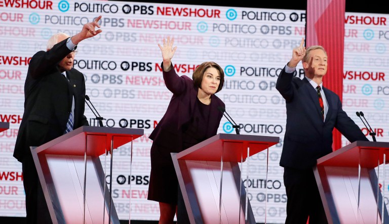 Democratic presidential candidates from left, Sen. Bernie Sanders, I-Vt., Sen. Amy Klobuchar, D-Minn., and businessman Tom Steyer vie to answer questions during a Democratic presidential primary debate Thursday, Dec. 19, 2019, in Los Angeles.