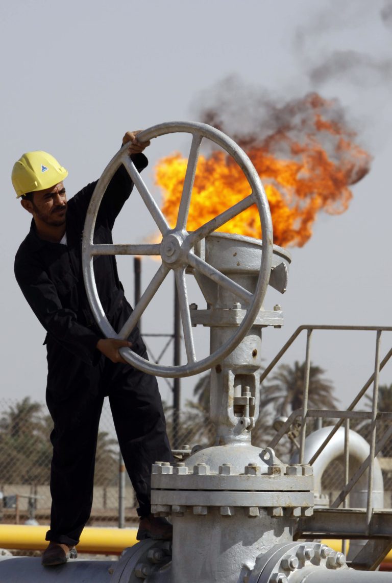   FILE - In this file photo of Friday, July 17, 2009, an Iraqi worker operates valves at the Nahran Omar oil refinery near the city of Basra, 340 miles (550 kilometers) southeast of Baghdad, Iraq. Iraq's rapidly expanding oil production is likely to complicate OPEC's efforts to influence world prices as the country re-emerges as a major player after 20 years on the sidelines due to sanctions and strife. (AP Photo/Nabil al-Jurani, File)  