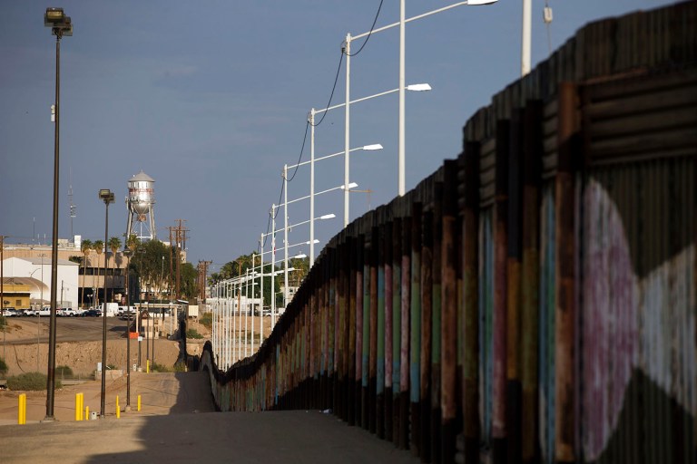 The Calexico water tower stands above the U.S. Border Inspection Station crossing along the border fence in Calexico, Calif. (Patrick T. Fallon/Bloomberg)