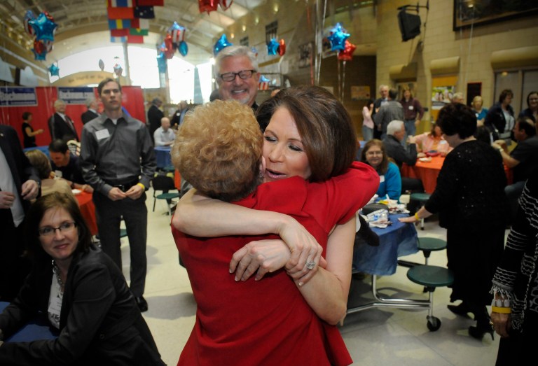 Rep. Michele Bachmann hugs a supporter during a Sixth Congressional District tribute event in her honor on Friday at Monticello High School in Monticello, Minn. (AP Photo/The St. Cloud Times, Dave Schwarz)