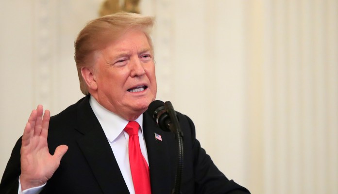 President Donald Trump speaks before awarding the Medal of Honor to Army Staff Sgt. Travis Atkins in the East Room of the White House, Wednesday March 27, 2019, in Washington.