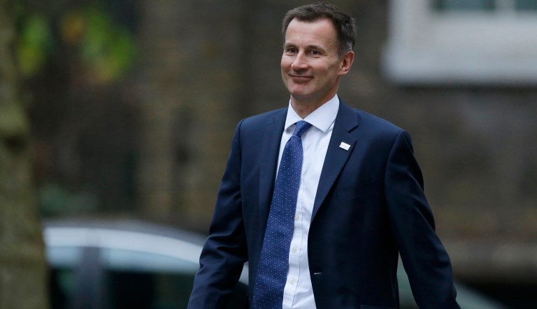 Britain's Health and Social Care Secretary Jeremy Hunt walks into 10 Downing Street for a meeting about his portfolio as Prime Minister Theresa May begins to reshuffle her Cabinet in London, Monday, Jan. 8, 2018. 
