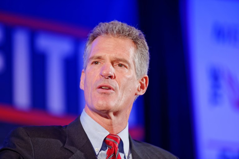 Scott Brown Sticks With the Candidate Defending Federal Health Care