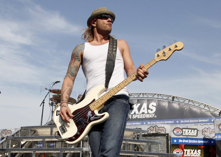 FILE - In this April 9, 2011 file photo, 3 Doors Down' bassist Todd Harrell performs before a NASCAR auto race at Texas Motor Speedway in Fort Worth, Texas. Harrell checked himself into a drug treatment facility after bonding out of jail, the musician's lawyer said Wednesday, April 24, 2013. Harrell is accused of driving under the influence and causing a fatal crash last weekend in a Nashville suburb. Police say the 41-year-old bassist admitted to drinking and taking prescription drugs before the wreck on Friday. (AP Photo/Tim Sharp, File)