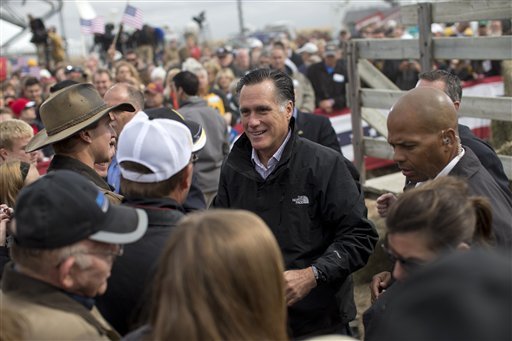 Republican presidential candidate, former Massachusetts Gov. Mitt Romney shakes hands with supporters during a campaign rally, Tuesday, Oct. 9, 2012, in Van Meter, Iowa.  (AP Photo/ Evan Vucci)