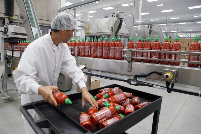 Sriracha chili sauce is produced at the Huy Fong Foods factory in Irwindale, Calif. The Commerce Department reports on wholesale prices for November on Friday, Dec. 13, 2013. (AP Poto/Nick Ut)