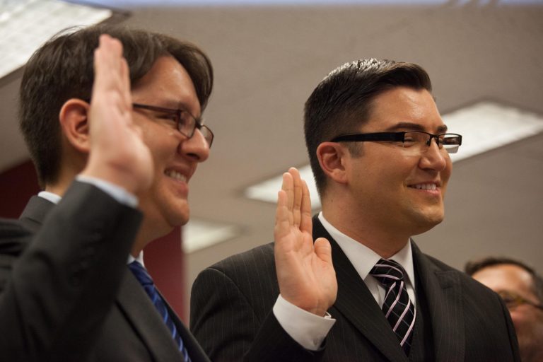 SEATTLE, WA - DECEMBER 6: Brendon K. Taga (L) and Jesse Pageat, the second couple to receive a same-sex marriage license in Washington state, at the King County Recorder's Office on December 6, 2012 in Seattle, Washington. The office opened at 12:01 AM PST to begin issuing marriage licenses to same-sex couples for the first time, after Washington voters chose to legalize same-sex marriage in November's election. (Photo by David Ryder/Getty Images)