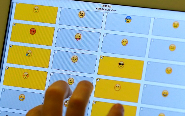 Apple said Monday that the pistol emoji will be removed from the keyboard and replaced with a lime green water pistol water when it rolls out its iOS 10 operating system in the fall. (AP Photo/Orlin Wagner)