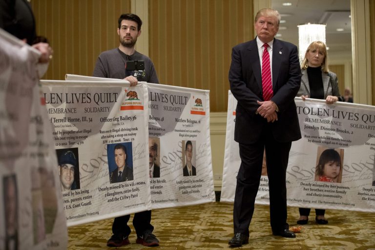 Republican presidential candidate Donald Trump, right, listens to remarks by individuals who identify themselves as family members of victims who were killed, at a news conference, Friday, July 10, 2015, in Beverly Hills, Calif. Trump discussed immigration. (AP Photo/Jae C. Hong)