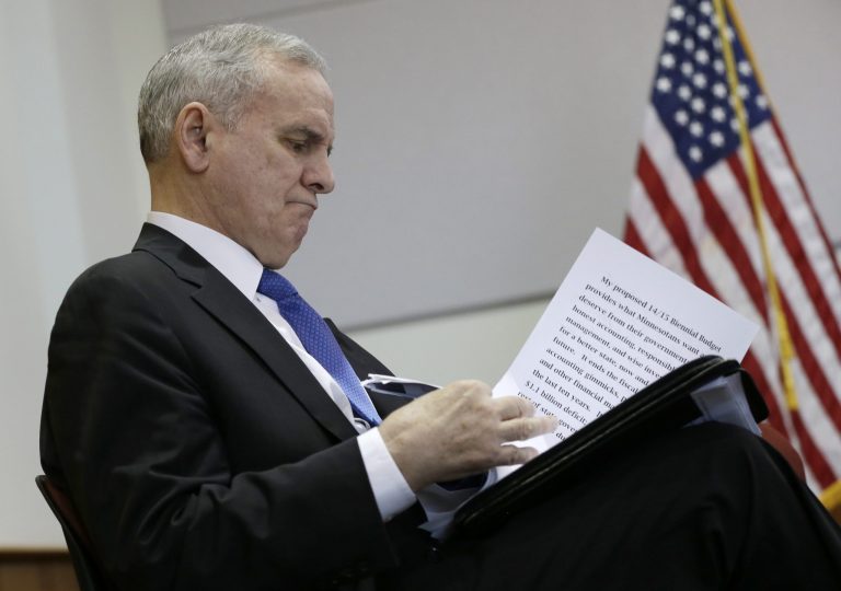 FILE - In this Jan. 22, 2013 file photo, Minnesota Gov. Mark Dayton looks at his notes after delivering his budget proposal in St. Paul, Minn. (AP File)