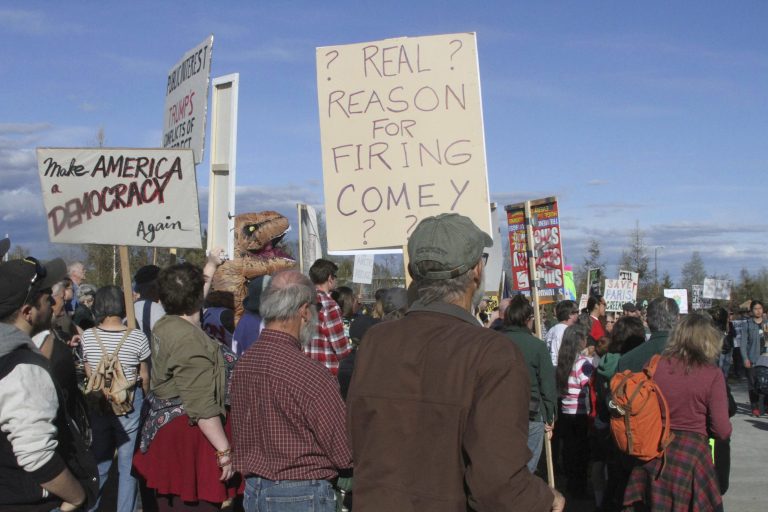 A few hundred people chanted slogans and made speeches to protest the presence of U.S. Secretary of State Rex Tillerson in Fairbanks, Alaska, on Wednesday, May 10, 2017. (AP Photo/Mark Thiessen)