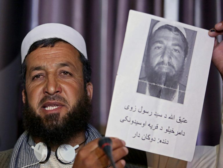 Sidiqullah holds a photograph of his brother, who went missing in Nov. 2012, during U.S. military operations in Wardak province, at a news conference in Kabul, Afghanistan, Monday, Aug. 11, 2014. The U.S. failed to properly investigate civilian killings, including possible war crimes, which occurred during its military operations in Afghanistan, the international rights group Amnesty International said Monday. NATO said it investigates all credible reports of civilian casualties, without responding to the group's specific claims.(AP Photo/Rahmat Gul)